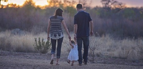 Child with parents_457x220