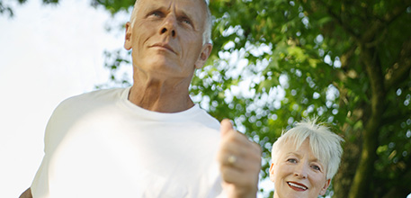 Elderly man and woman jogging_457x220