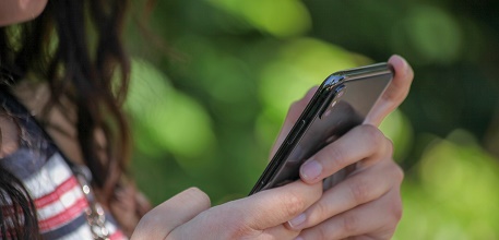 Girl on phone_457x220