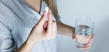 Pill and glass of water_457x220