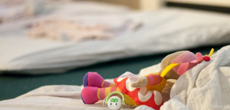 Doll on nursery bed