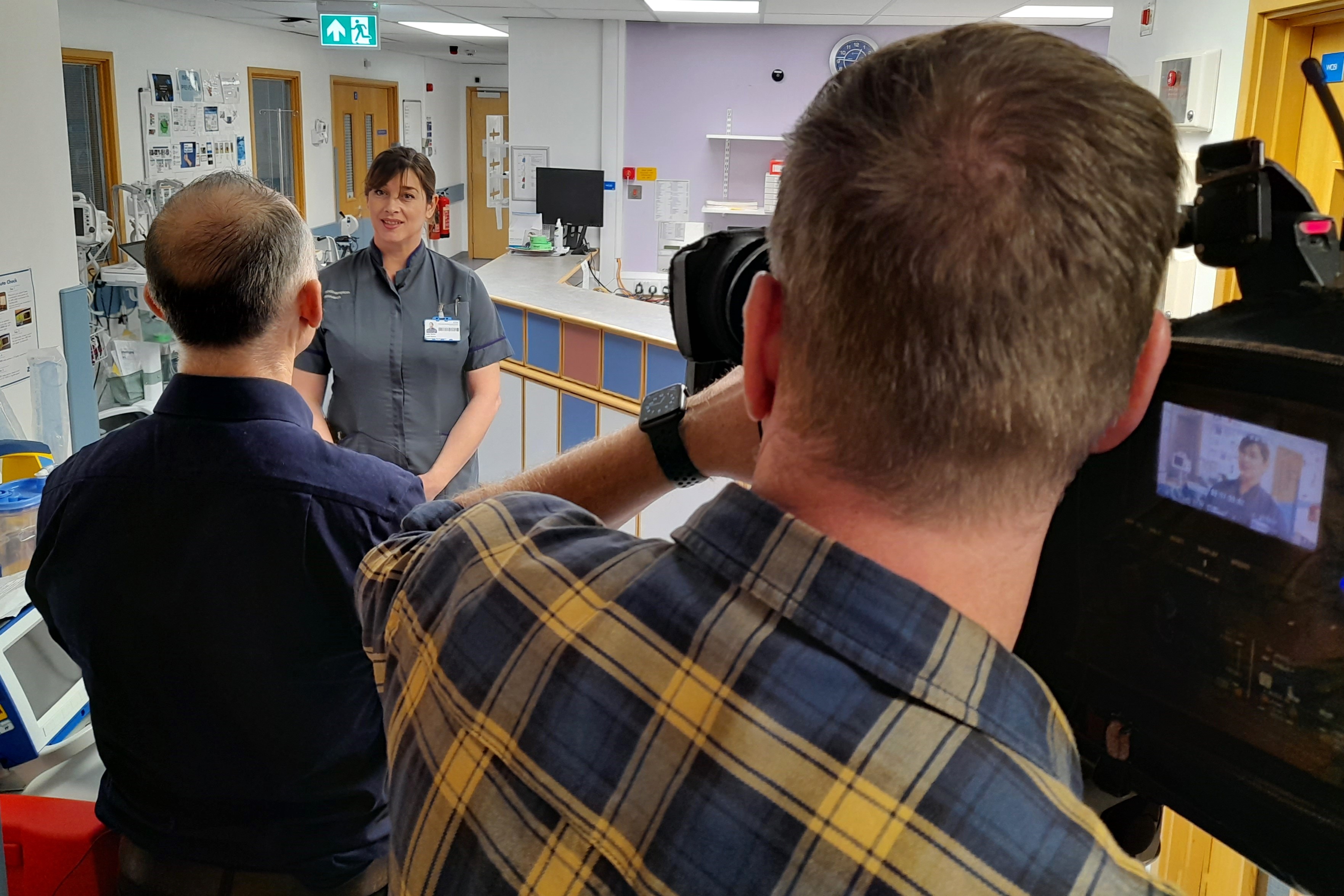 Research nurse speaking to people