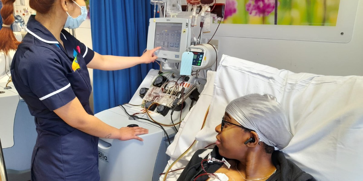 A UHS nurse helps patient, Abena, with her exchange transfusion using a new machine. 