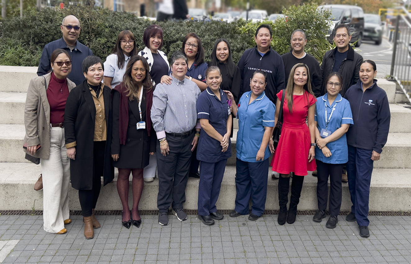 A group of Filipino nurses stood outside of the hospital