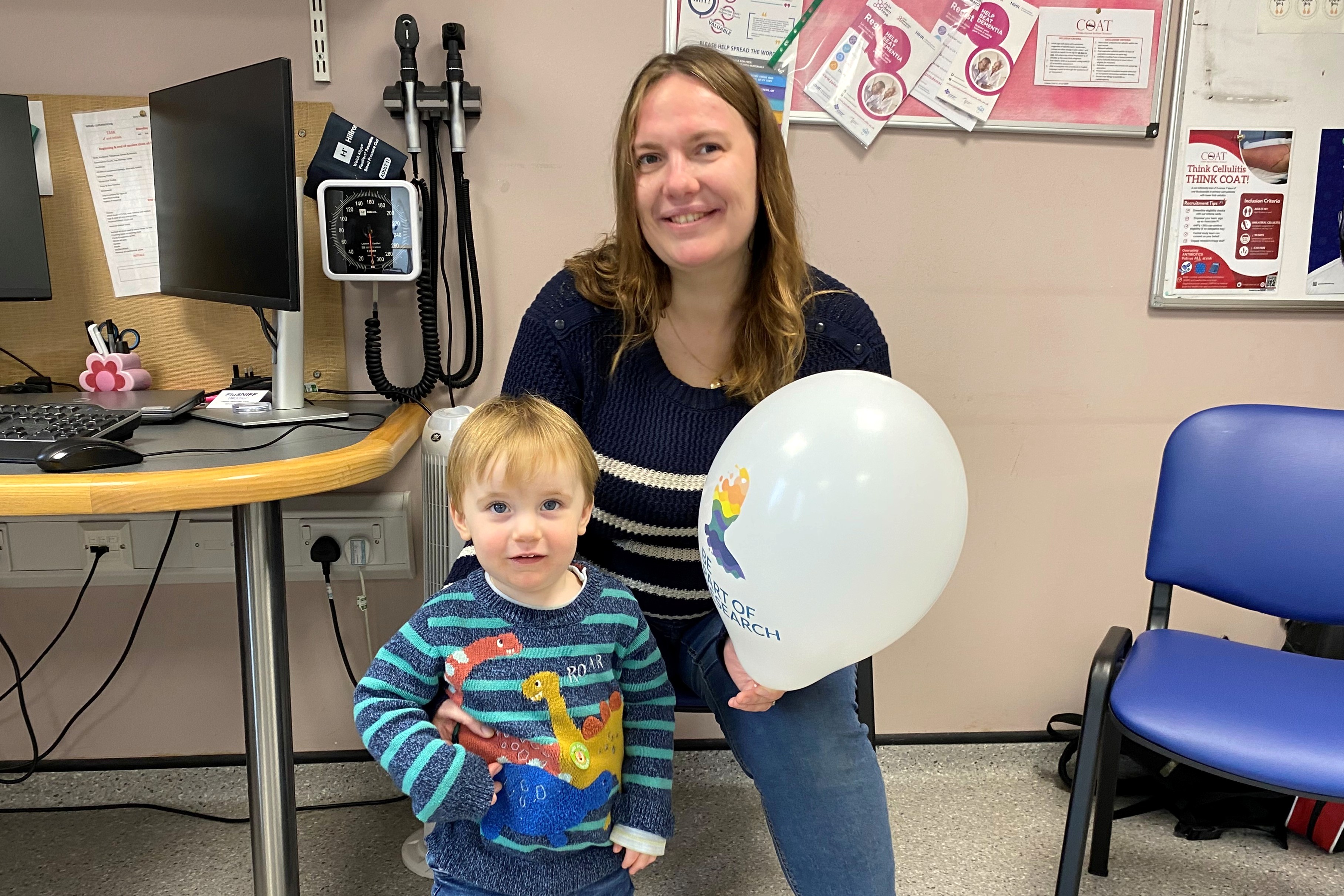 Ros Gough sat with her son Eddie, holding a balloon