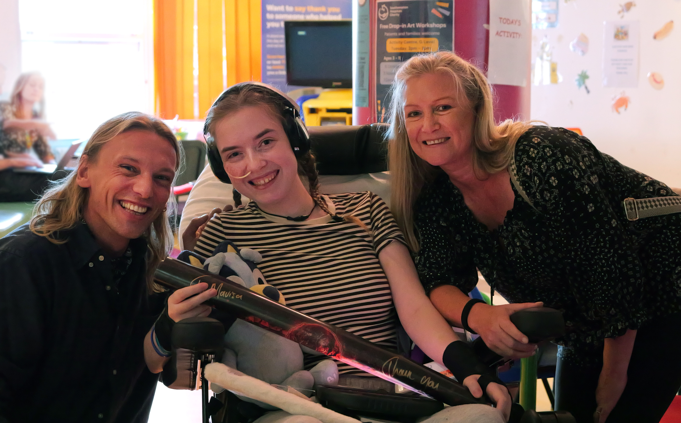 Jamie Campbell Bower with patient and her mum