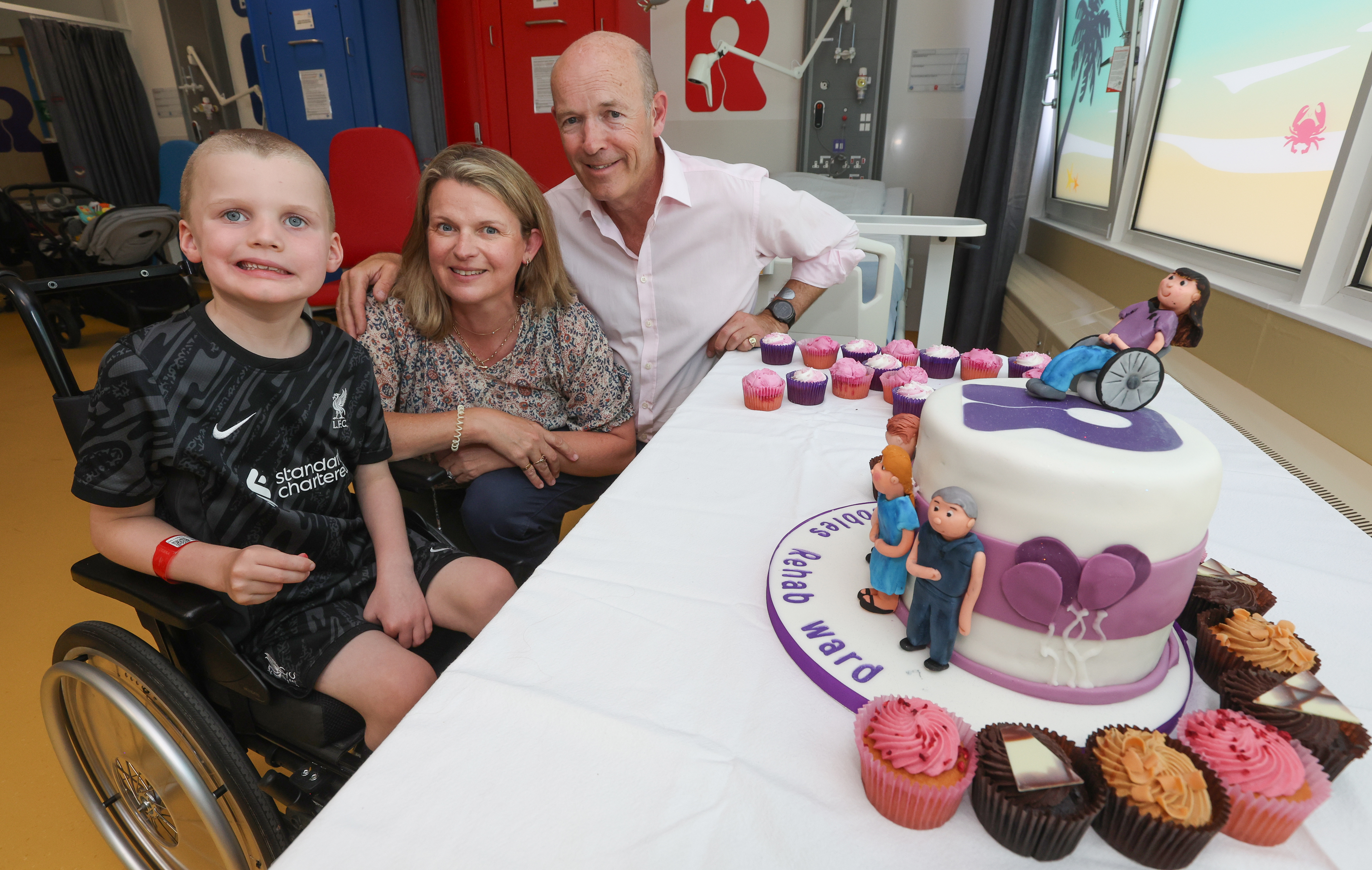 Young SCH patient Connor, with Robbie's dad Mark Keville and his wife Floss.