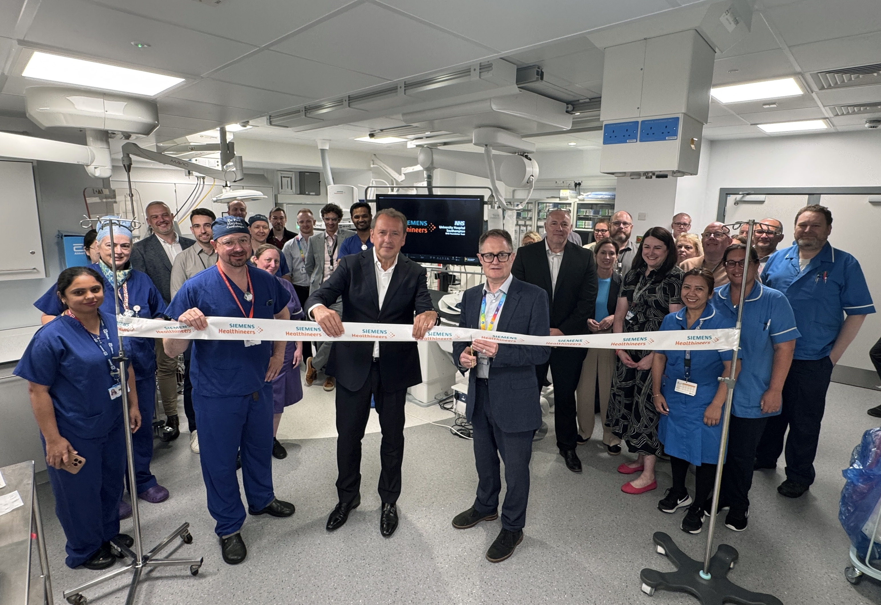 Paul Grundy chief medical officer at UHS and the cath lab clinical team at official opening