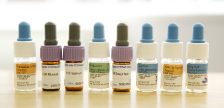 A line showing a selection of the bottles used in an allergy test.