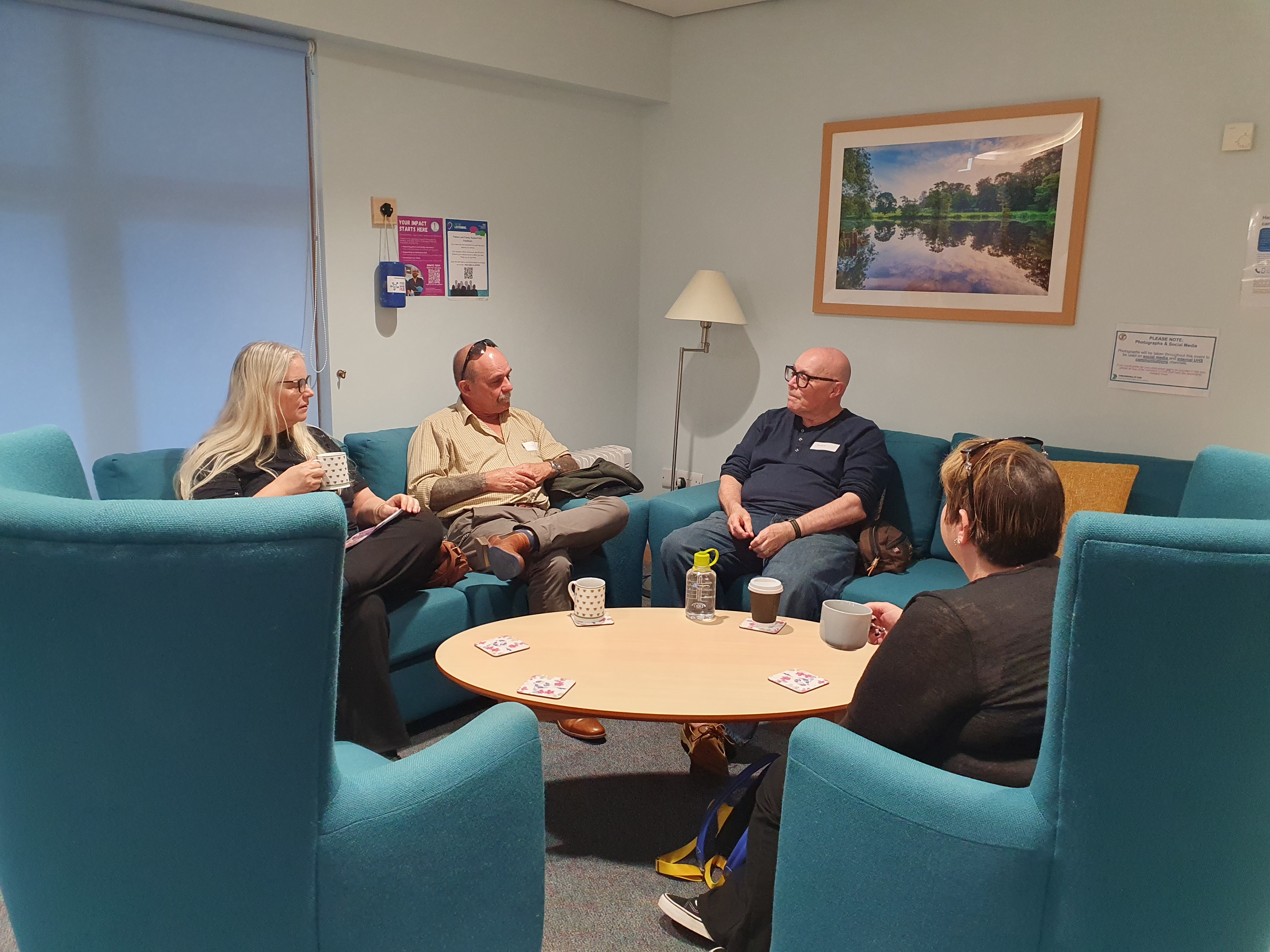 Four people sat talking at the ICU support group