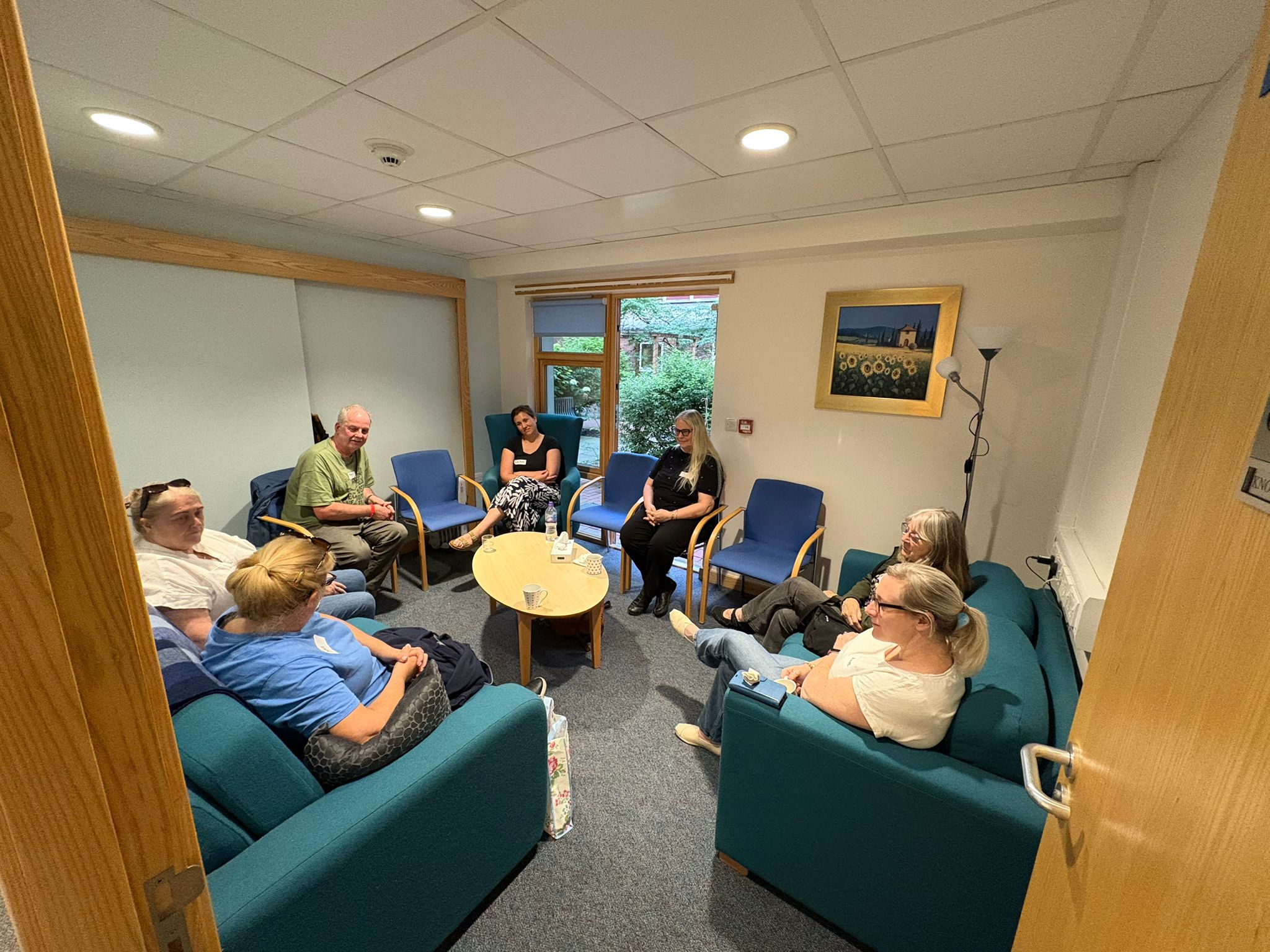 A relaxed circle of people at at the ICU support group
