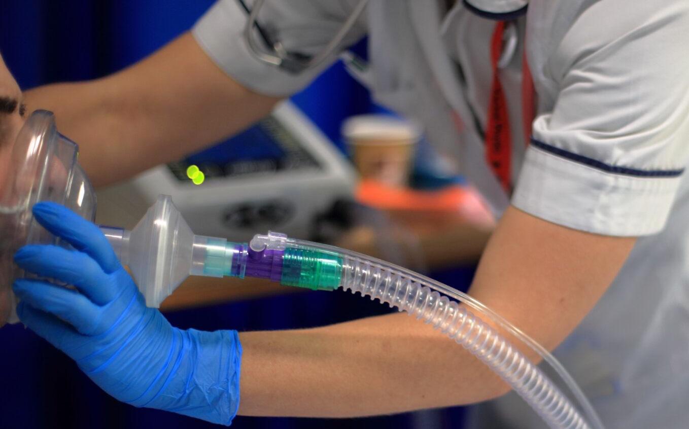 Patient with a respiratory mask on