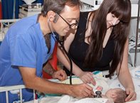 Doctor with baby and mother
