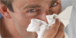 Male blowing nose