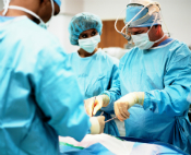 Three surgeons performing an operation