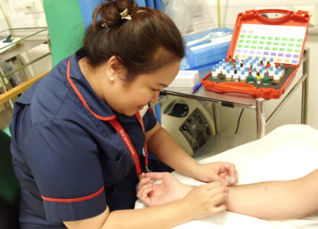 A nurse carrying out skin prick testing