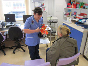 Staff nurse Jo Hall talking to patient