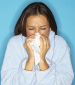 Woman blowing her nose