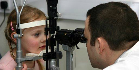 Jay Self with patient in clinic